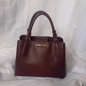 Maroon colored Michael Kors purse
